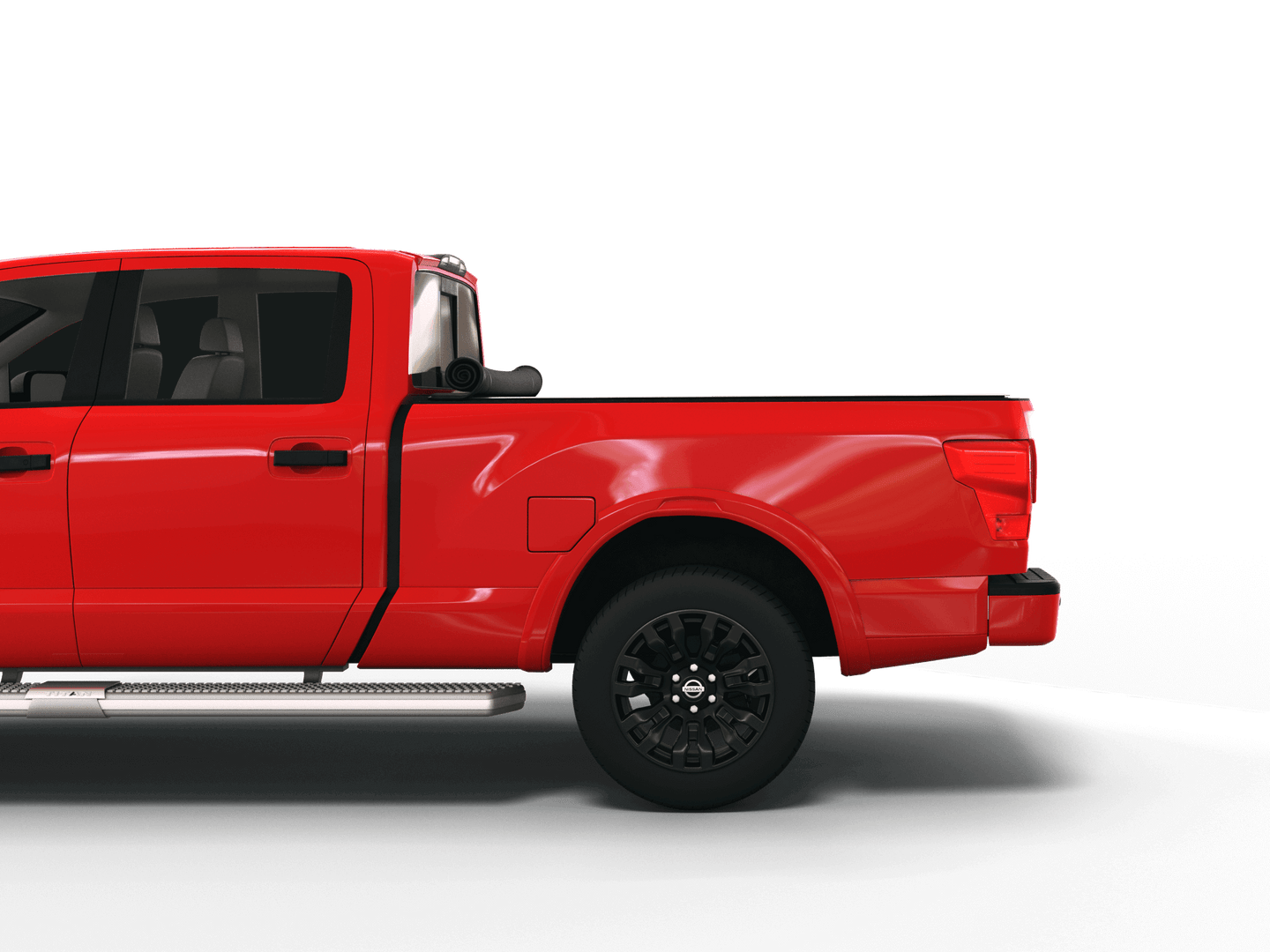 Red Nissan Titan with Sawtooth Stretch expandable pickup truck bed cover rolled up at cab